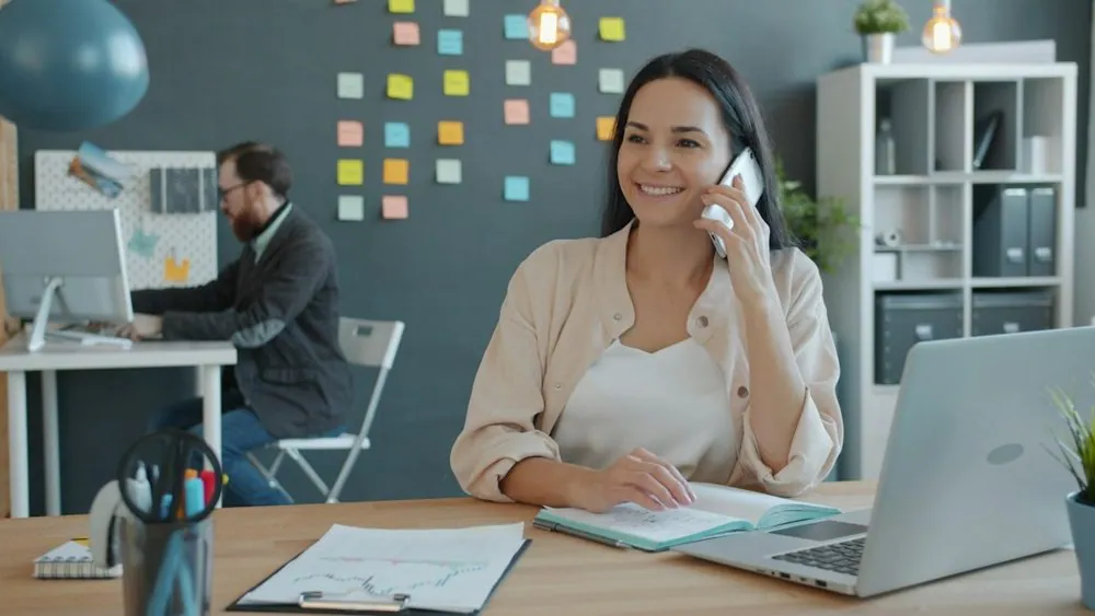 Office receptionist on the phone at her desk