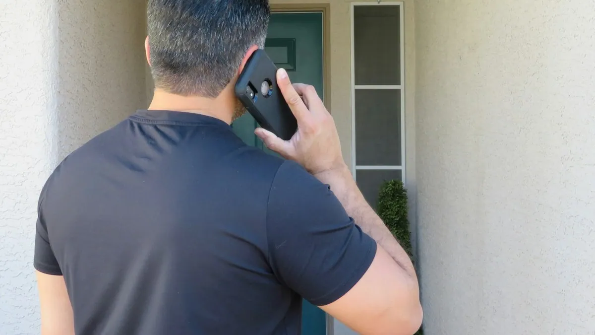 Man holding a cell phone up to his ear