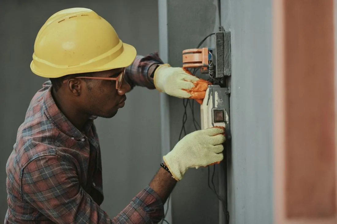 Electrician wiring a panel