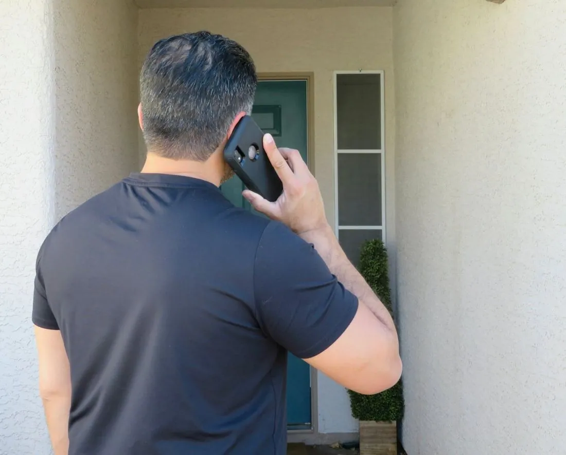 Contractor taking a call on his phone